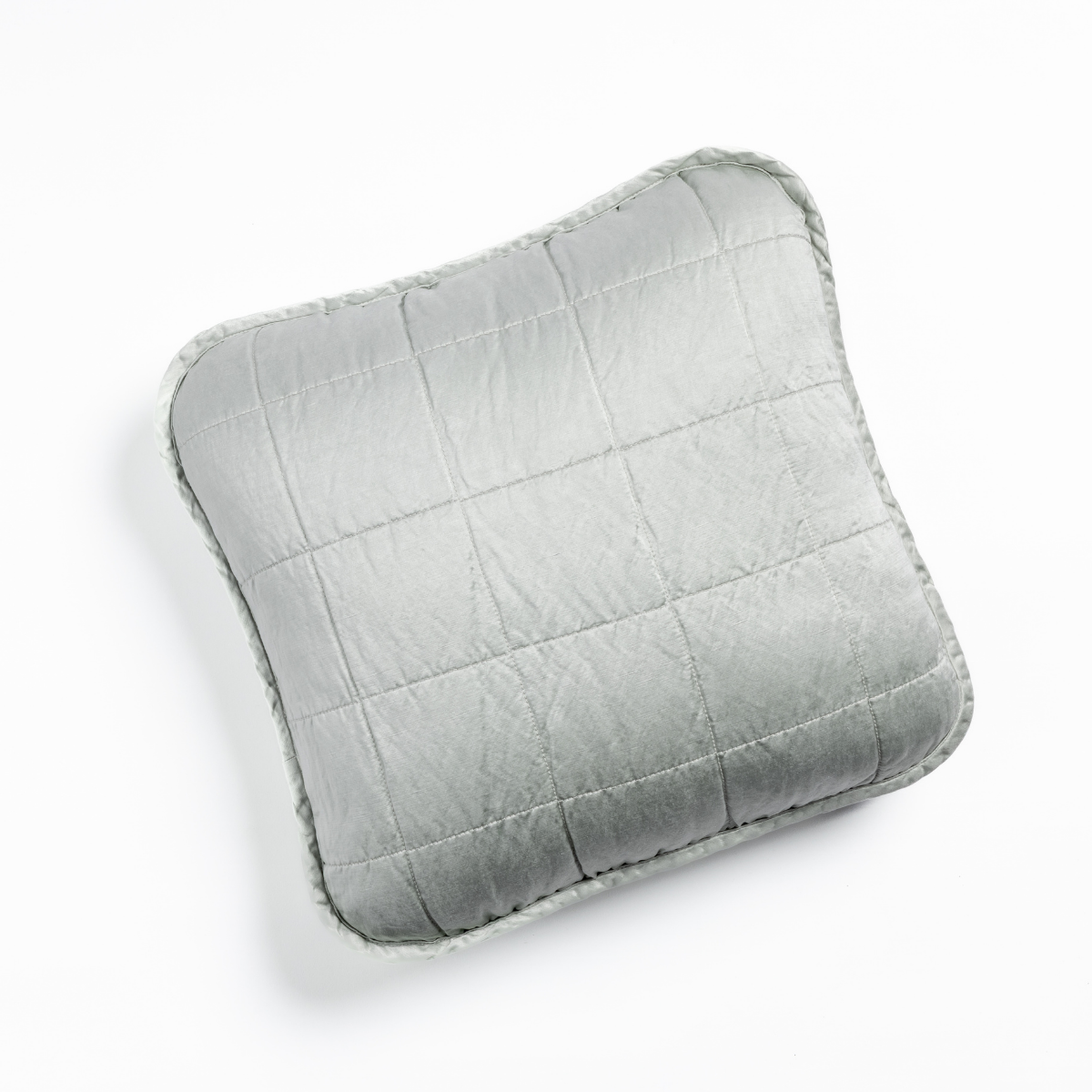 Sel Throw Pillow | Cloud | An overhead shot of a square-quilted square throw pillow in cloud, a subtle sky blue-grey, against a white background.