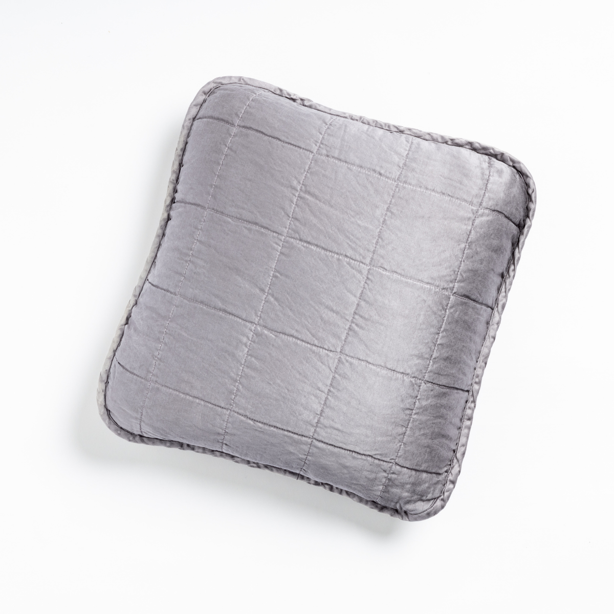 Sel Throw Pillow | French Lavender | An overhead shot of a square-quilted square throw pillow in french lavender, a neutral violet tone, against a white background.
