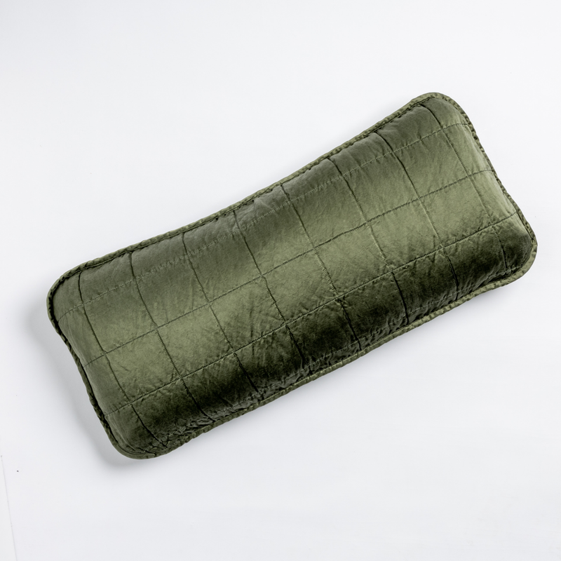 Sel Throw Pillow | Juniper | An overhead shot of a square-quilted rectangle throw pillow in juniper, a deeply saturated dark green, against a white background.