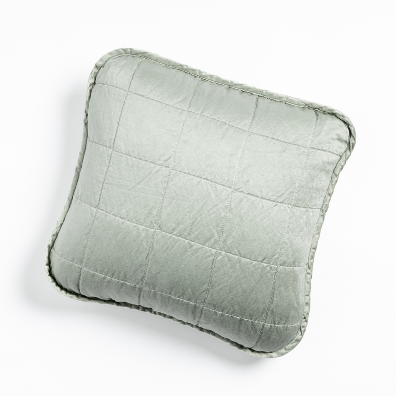 Sel Throw Pillow | Mineral | An overhead shot of a square-quilted square throw pillow in mineral, a soothing seafoam blue with subtle grey-green undertones, against a white background.