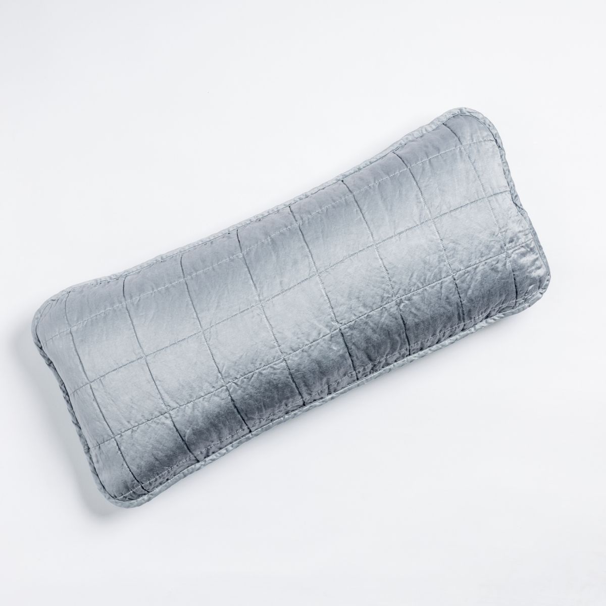 Sel Throw Pillow | Tahoe Blue | An overhead shot of a square-quilted rectangle throw pillow in tahoe blue, a crisp true blue, against a white background.