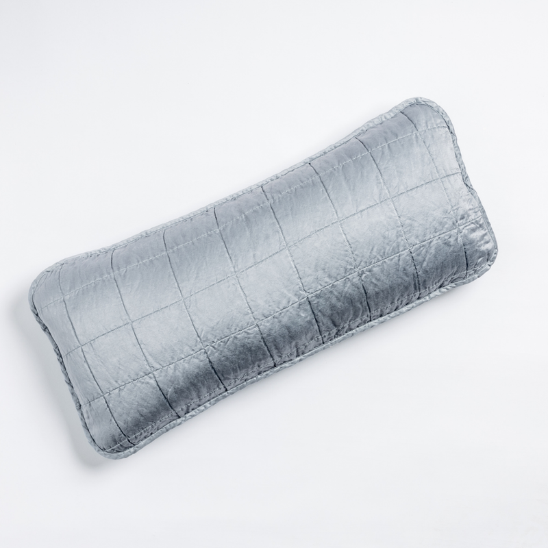 Sel Throw Pillow | Tahoe Blue | An overhead shot of a square-quilted rectangle throw pillow in tahoe blue, a crisp true blue, against a white background.