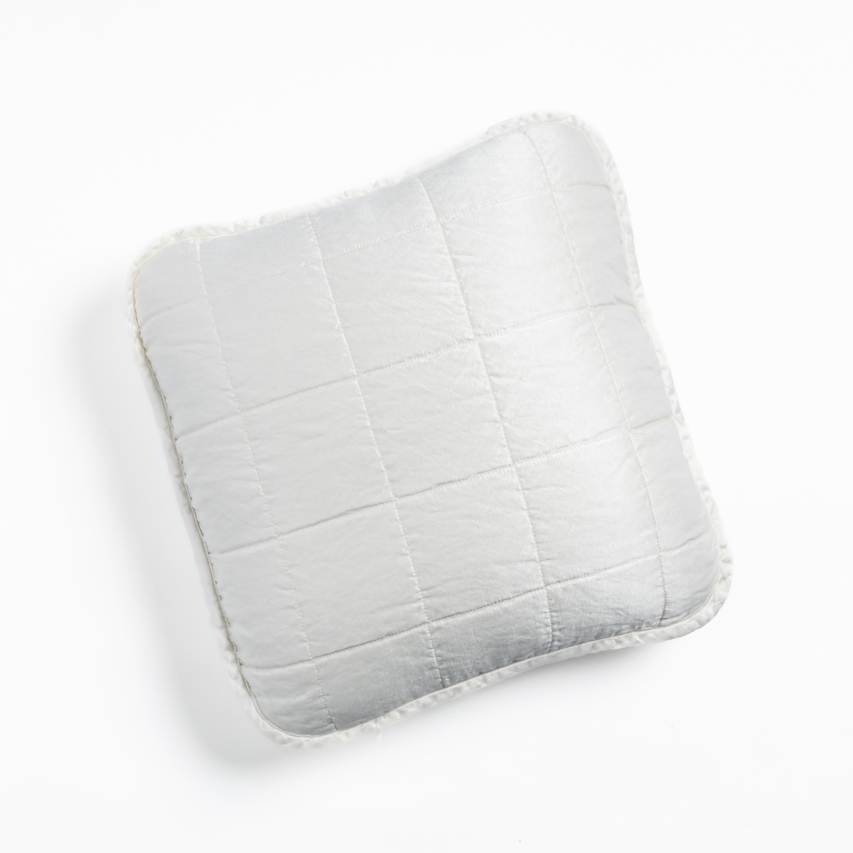 Sel Throw Pillow | White | An overhead shot of a square-quilted square throw pillow in white, against a white background.