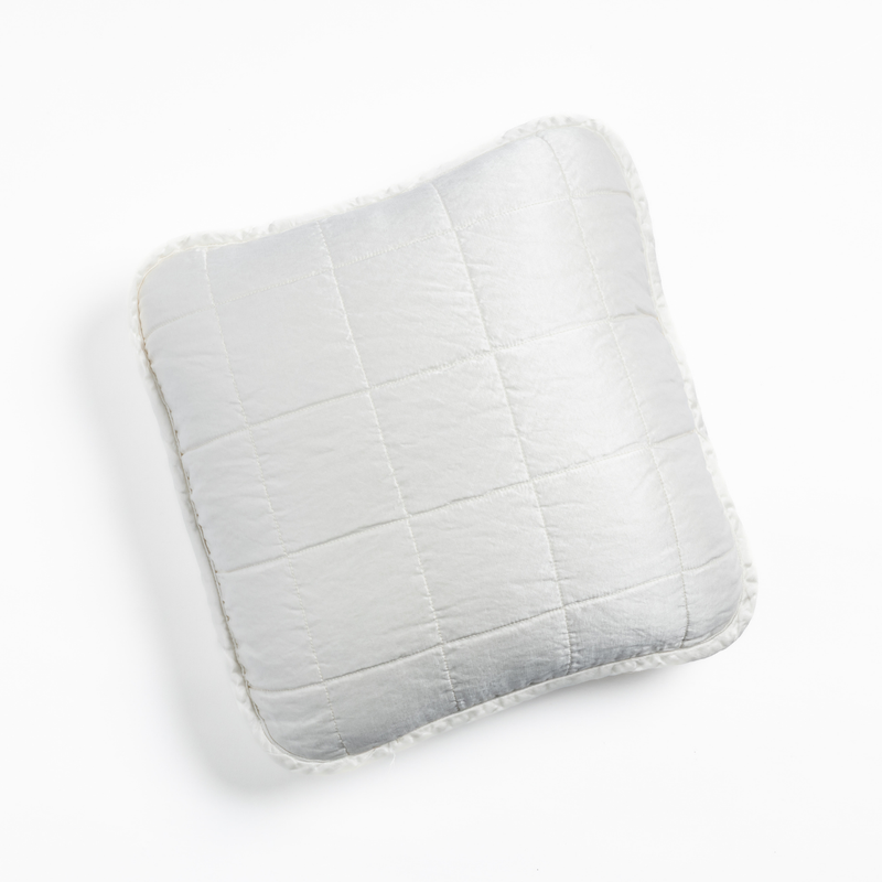 Sel Throw Pillow | White | An overhead shot of a square-quilted square throw pillow in white, against a white background.