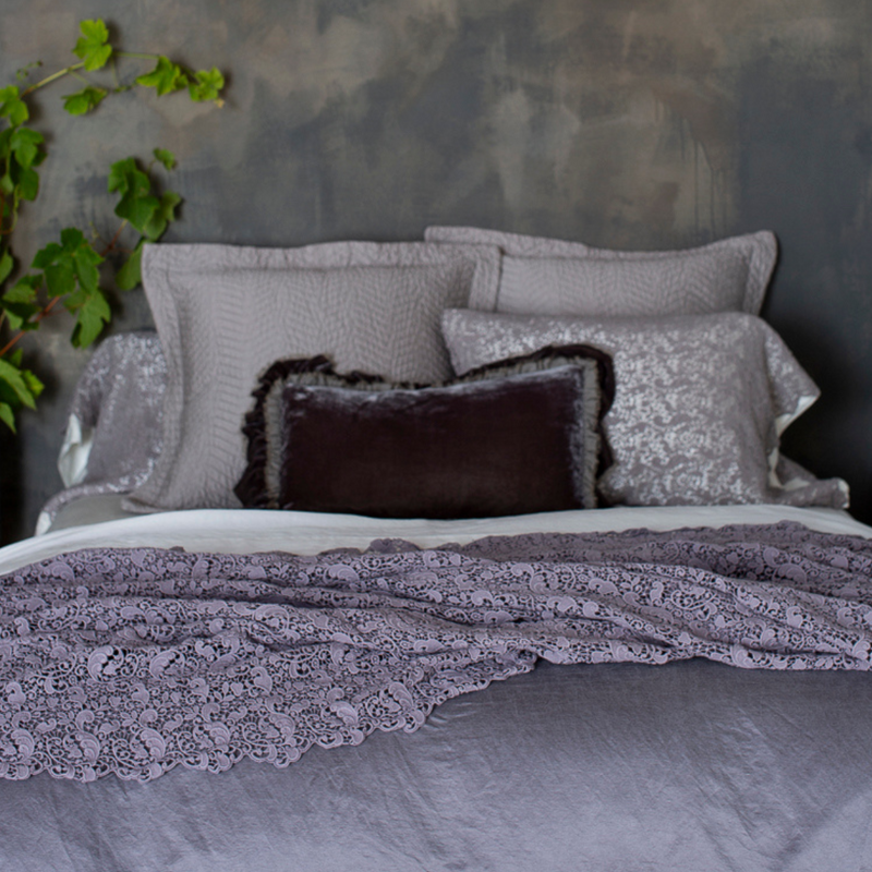 Allora Bed Scarf | lace bed scarf on monochromatic bed shot from the foot of the bed with the pillows at the head of the bed slightly out of focus.
