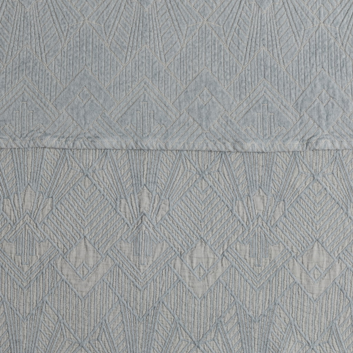 The Trettino Collection | Cloud | a close-up showing the chenille jacquard on the top half and cotton jacquard on the bottom in cloud, a pale light blue.