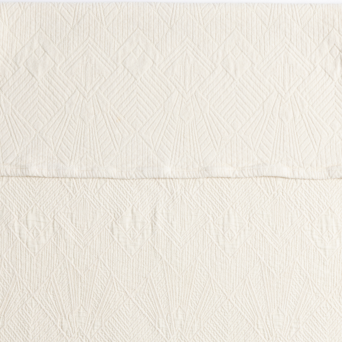 The Trettino Collection | Natural | a close-up showing the chenille jacquard on the top half and cotton jacquard on the bottom in natural, a warm neutral