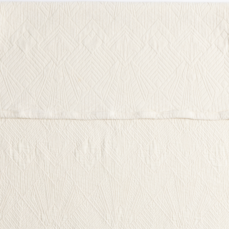 The Trettino Collection | Natural | a close-up showing the chenille jacquard on the top half and cotton jacquard on the bottom in natural, a warm neutral