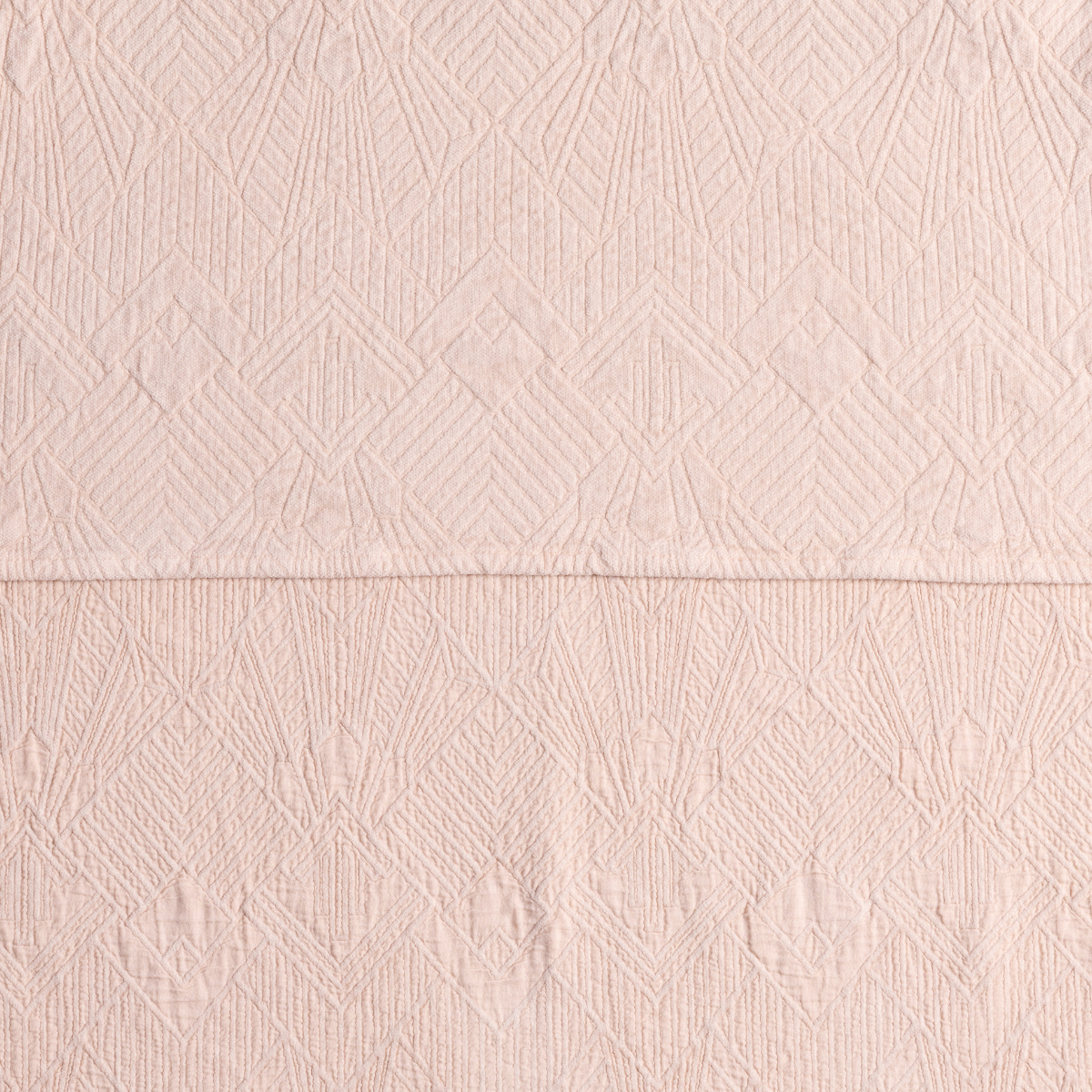 The Trettino Collection | Pearl | a close-up showing the chenille jacquard on the top half and cotton jacquard on the bottom in pearl, a pale pink tone.