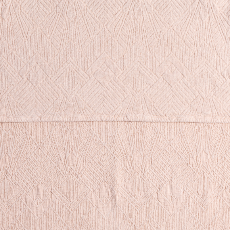 The Trettino Collection | Pearl | a close-up showing the chenille jacquard on the top half and cotton jacquard on the bottom in pearl, a pale pink tone.