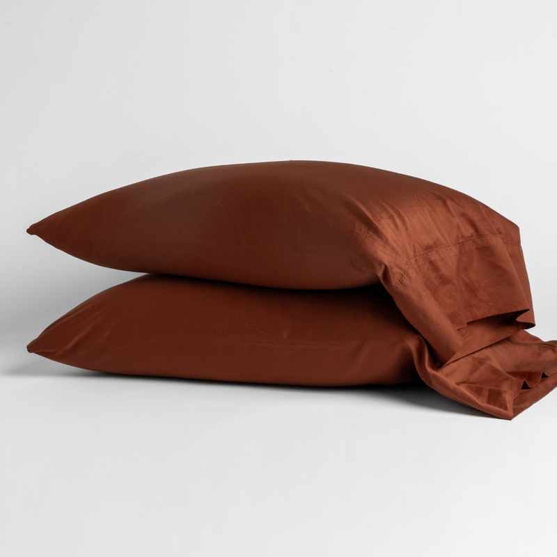 Bria Standard Pillowcase (Single) | Autumn | A pair of Bria pillowcases in Autumn, a rich terracotta tone, shown against a white background.