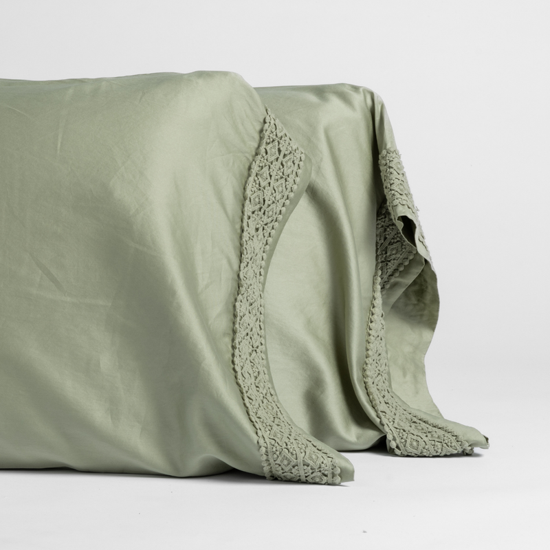 Bria Pillowcase (Single) | Desert Sage | matching pillowcases with lace in desert sage, a serenely elegant green, offering a hushed hue, shown against a plain background.