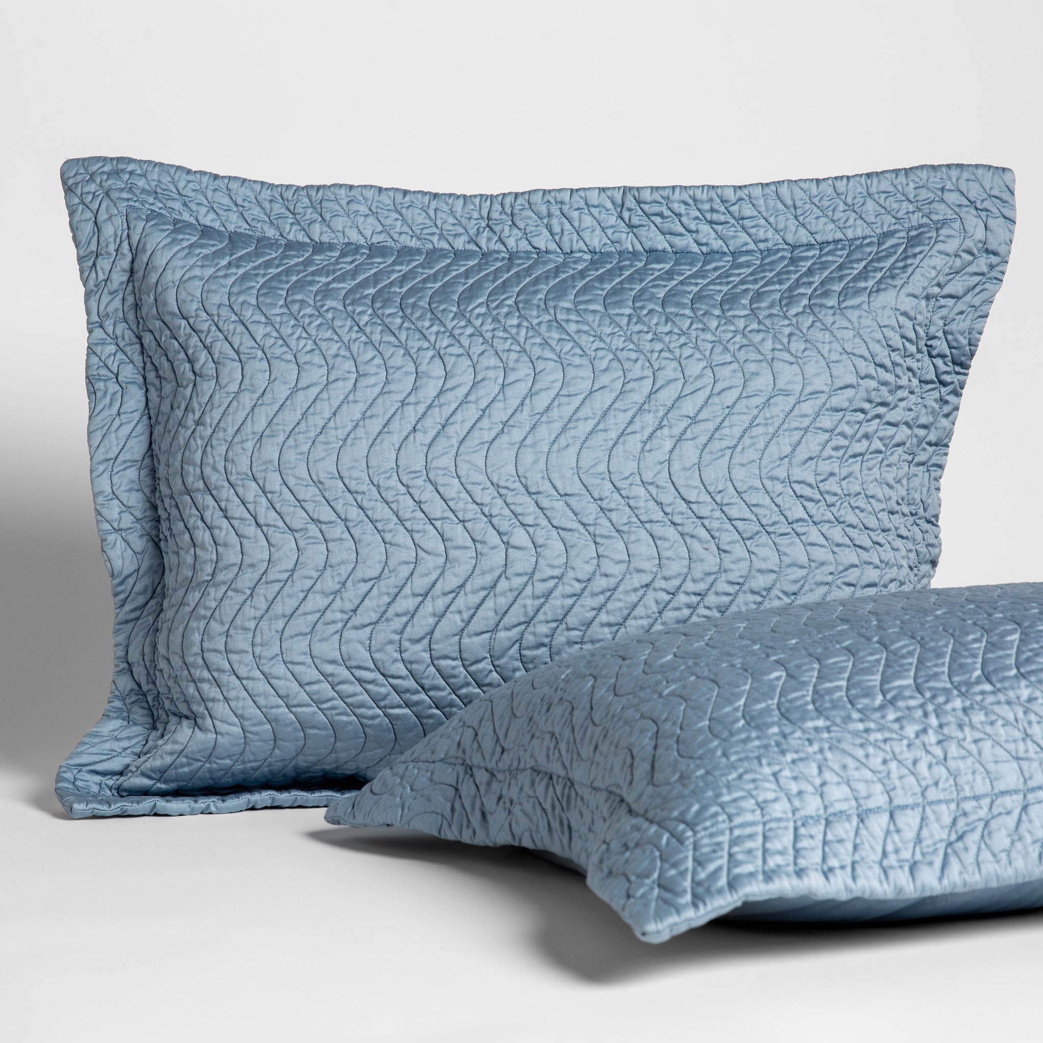 Cirillo Throw Pillow | Tahoe Blue | 2 15x24 quilted cotton sateen throw pillows shot overhead against a white background.
