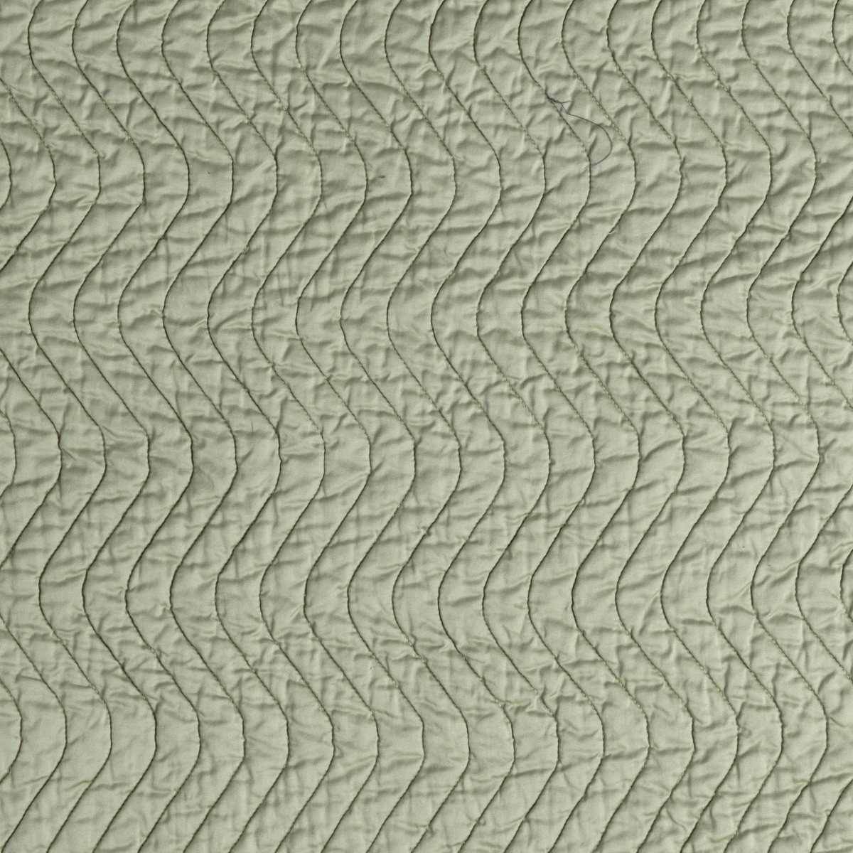Cirillo Coverlet | Desert Sage | close-up of cirillo fabric in desert sage, a serenely elegant green, offering a hushed hue.