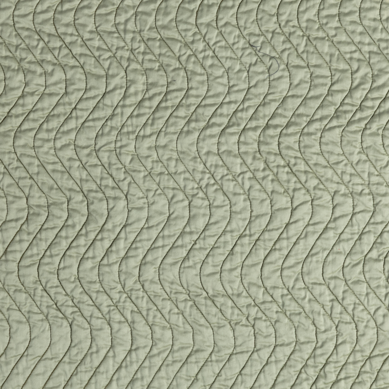Cirillo Coverlet | Desert Sage | close-up of cirillo fabric in desert sage, a serenely elegant green, offering a hushed hue.