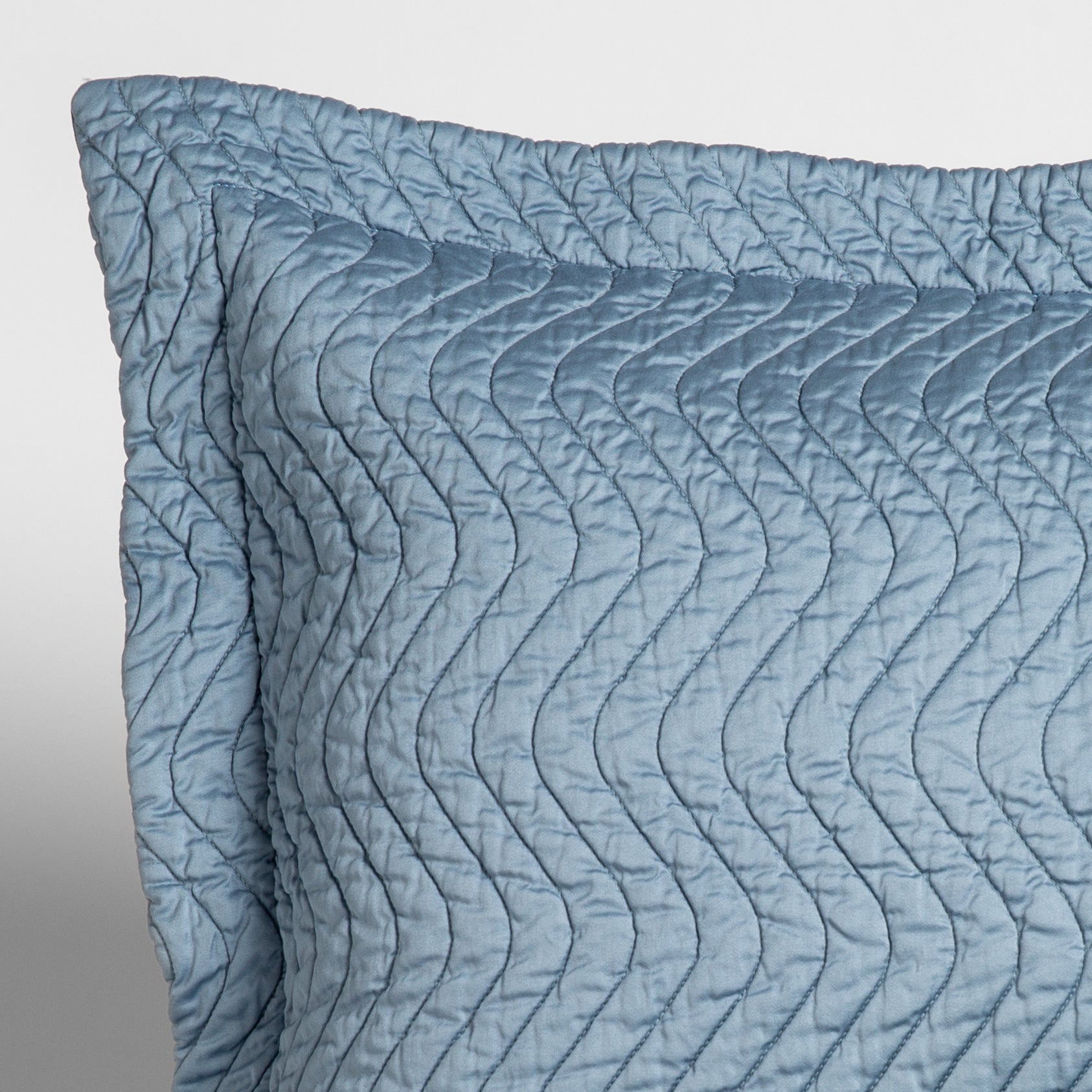 Cirillo Sham | Tahoe Blue | close up of the corner of a quilted cotton sateen pillow sham - shot against a white background.
