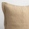 Cirillo Throw Pillow | Honeycomb | a close up of a pillow corner showing the flange framing quilted cotton sateen shot against a white background.