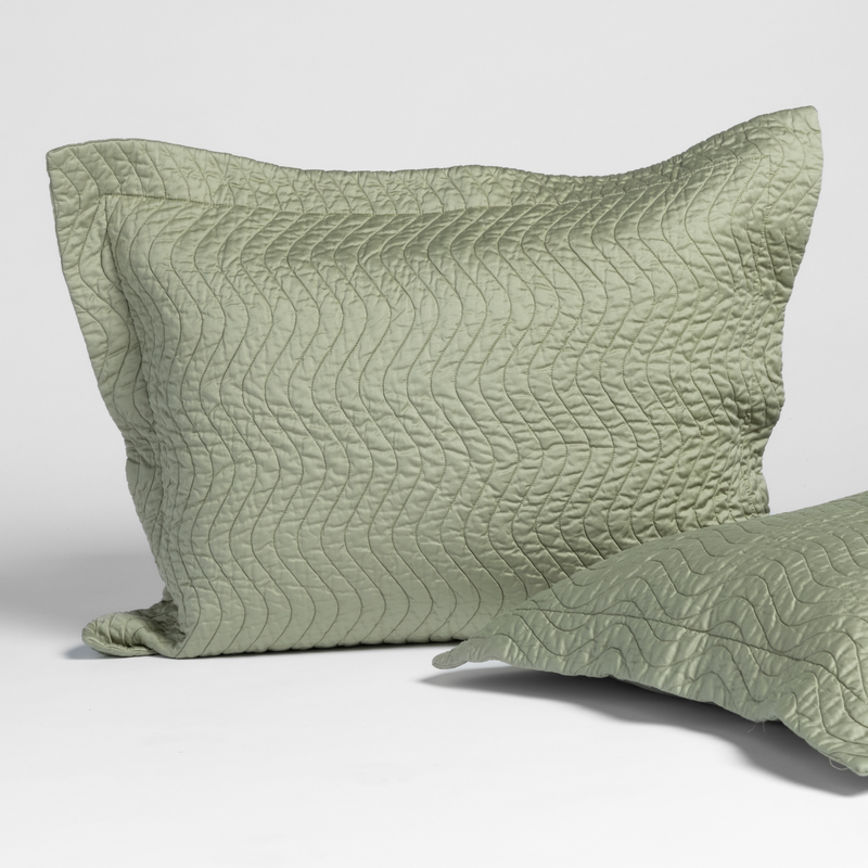 Cirillo Sham | Desert Sage | matching shams in desert sage, a serenely elegant green, offering a hushed hue, shown against a plain background.
