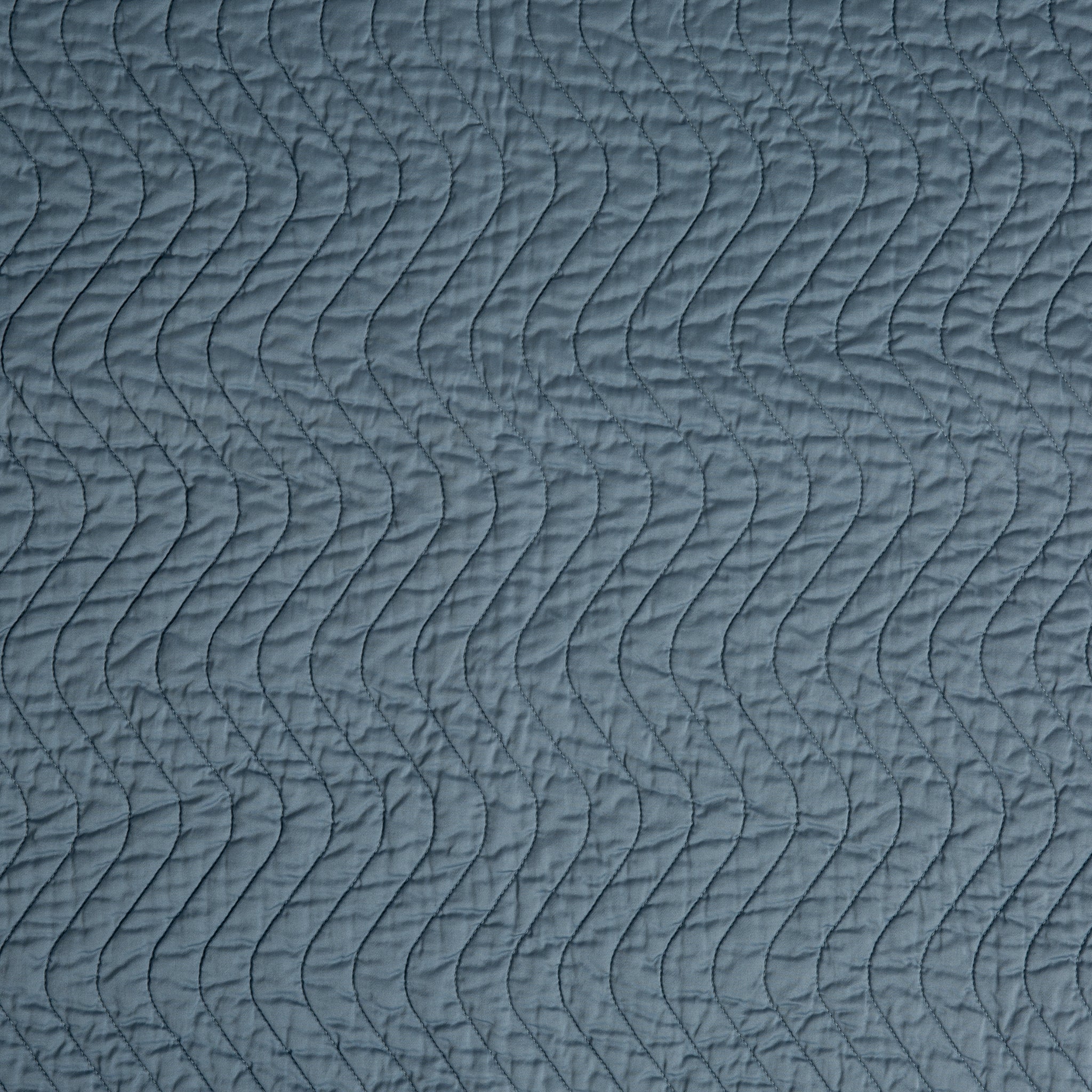 Cirillo Sham | Tahoe Blue | A close up of quilted cotton sateen fabric in tahoe blue, a true blue - like a clear sky.