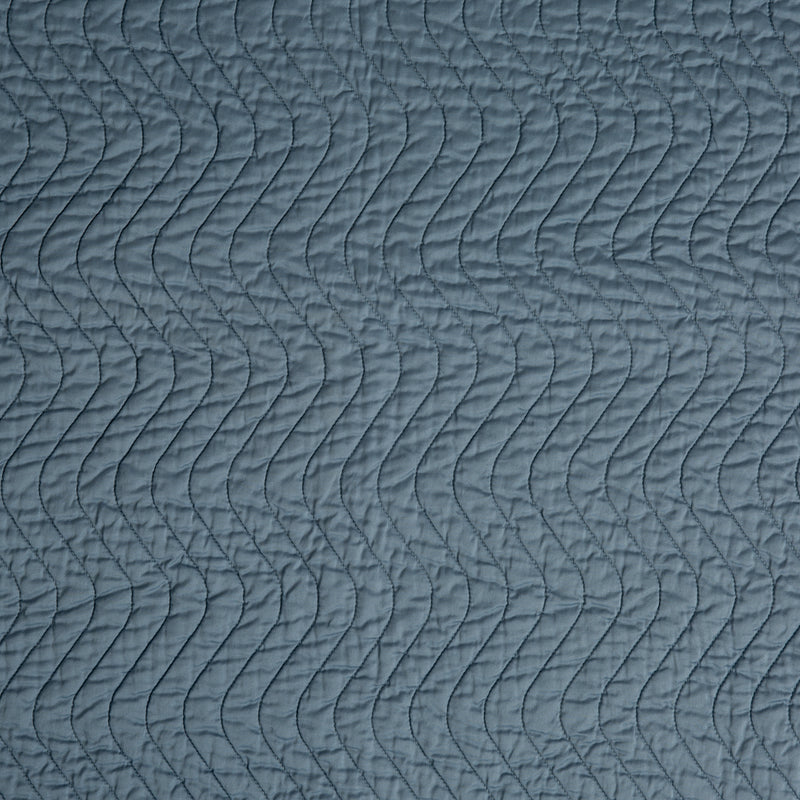 Cirillo Baby Blanket | Tahoe Blue | A close up of quilted cotton sateen fabric in tahoe blue, a true blue - like a clear sky.