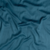 Bria Twin Flat Sheet | Cenote | A close up of cotton sateen fabric in cenote, a vibrant, ocean-inspired blue-green.