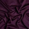 Bria Twin Fitted Sheets | Fig | A close up of cotton sateen fabric in fig, a richly saturated purple-garnet.