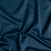 Bria Twin Flat Sheet | Midnight | A close up of cotton sateen fabric in midnight, a rich indigo tone.