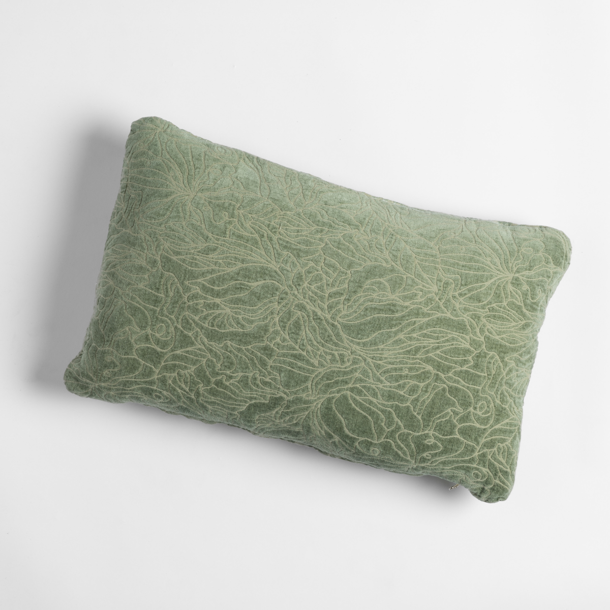 Georgia Throw Pillow | Desert Sage | shot from overhead, a throw pillow in desert sage, a serenely elegant green, offering a hushed hue, shown against a plain background.