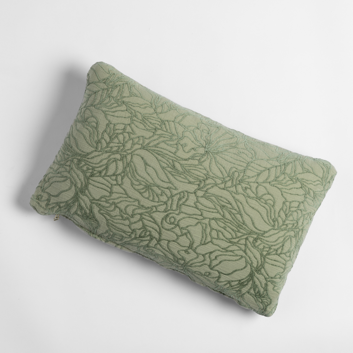 Georgia Throw Pillow | Desert Sage | shot from overhead, a throw pillow in desert sage, a serenely elegant green, offering a hushed hue, shown against a plain background.