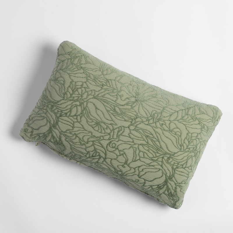 Georgia Throw Pillow | Desert Sage | shot from overhead, a throw pillow in desert sage, a serenely elegant green, offering a hushed hue, shown against a plain background.