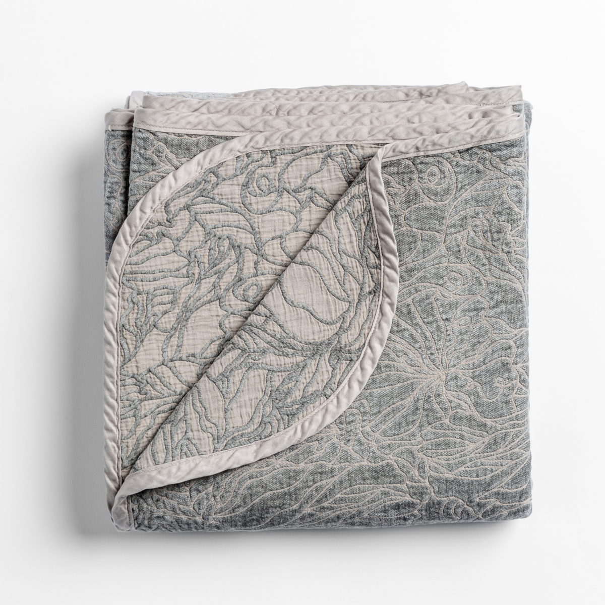 Georgia Blanket | Fog | folded blanket with its cotton jacquard side visible on the corner foldback against the chenille jacquard side.