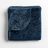 Georgia Blanket | Midnight | folded blanket with its cotton jacquard side visible on the corner foldback against the chenille jacquard side.