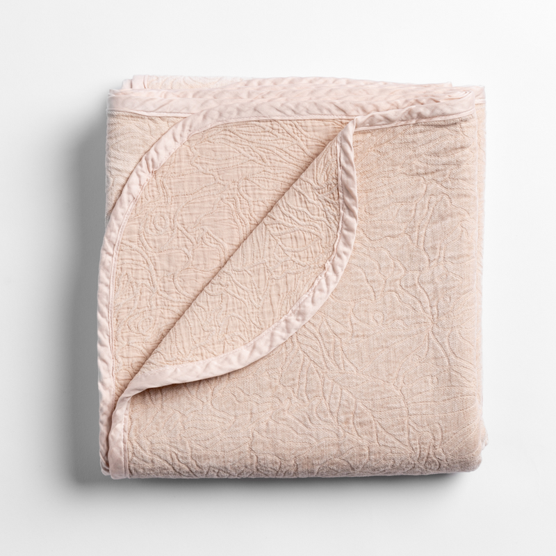 Georgia Blanket | Pearl | folded blanket with its cotton jacquard side visible on the corner foldback against the chenille jacquard side.