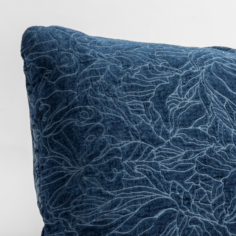 Georgia Throw Pillow | Midnight | close up of the chenille jacquard corner of a pillow cushion with a single-line floral pattern.