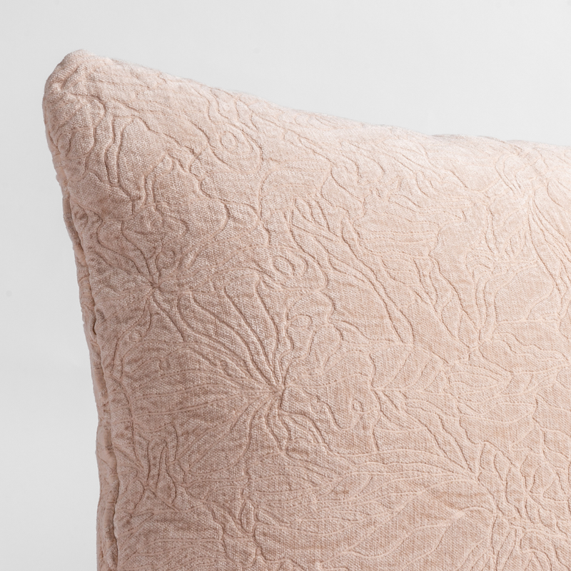 Georgia Throw Pillow | Pearl | close up of the chenille jacquard corner of a pillow cushion with a single-line floral pattern.