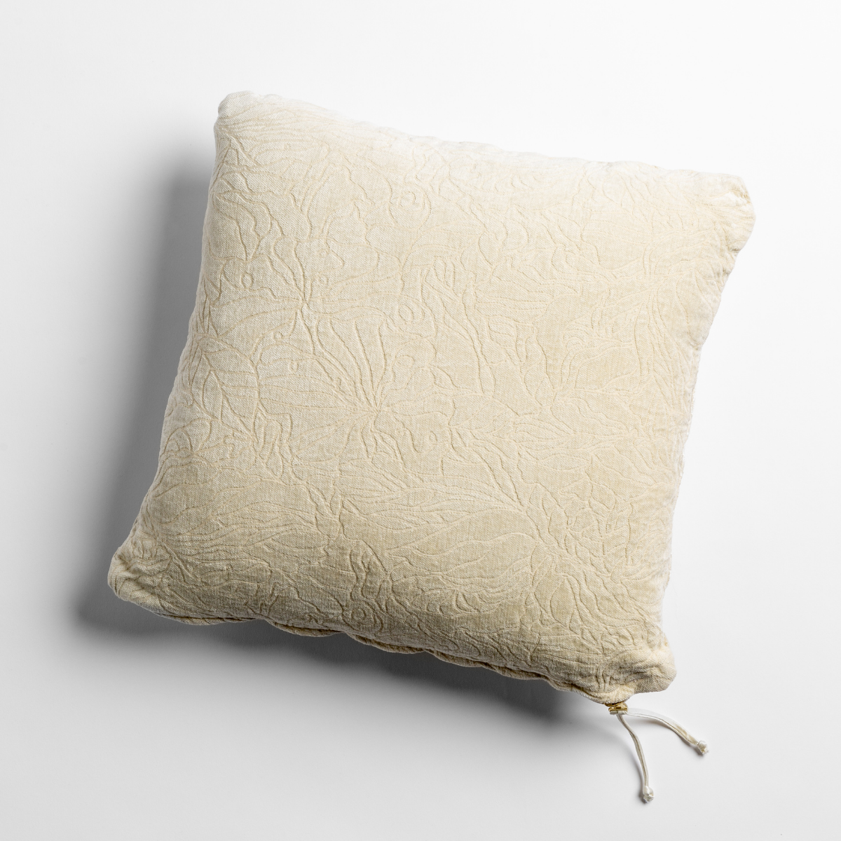 Georgia Throw Pillow | Parchment | chenille jacquard side of a georgia square cushion shown from overhead against a white background.