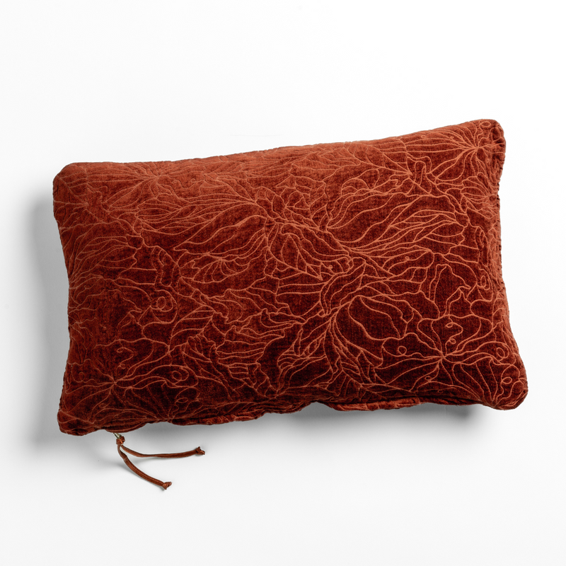 Autumn | A close-up of a chenille jacquard side of a Georgia Throw Pillow in Autumn, a rich terracotta tone, shown against a white background.