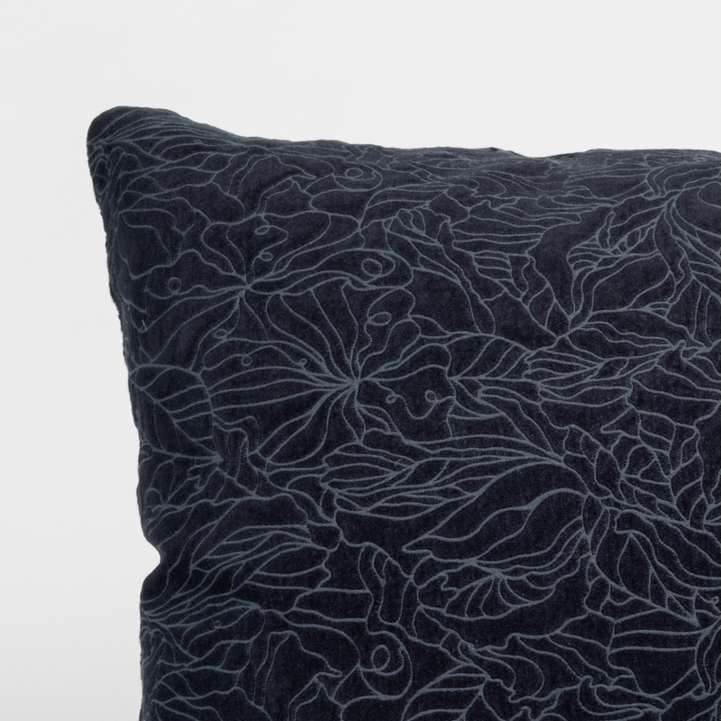 Georgia Throw Pillow | Slate | close-up of a georgia sham corner in slate, a polished dusky dark blue, against a plain white background.