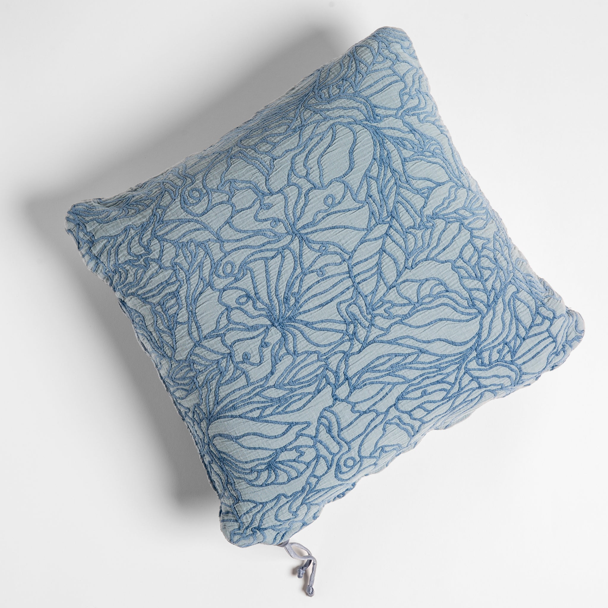 Georgia Throw Pillow | Tahoe Blue | cotton jacquard side of a georgia square cushion shown from overhead against a white background.