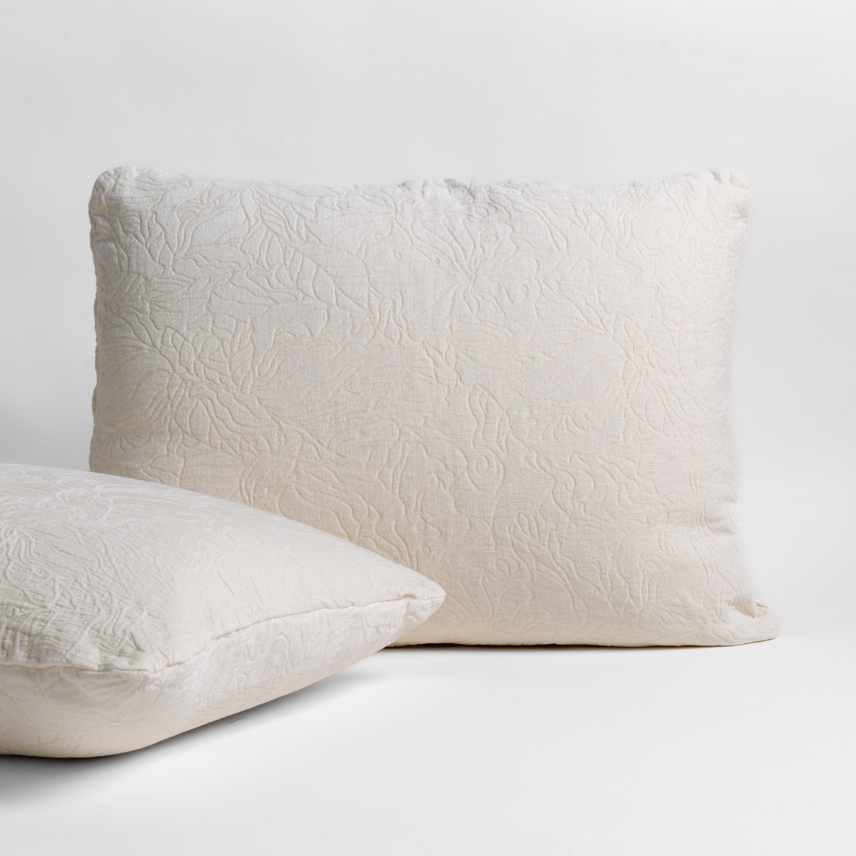 Georgia Sham | Winter White | pair of shams shown against a white background show the chenille and cotton jacquard faces and floral motif.