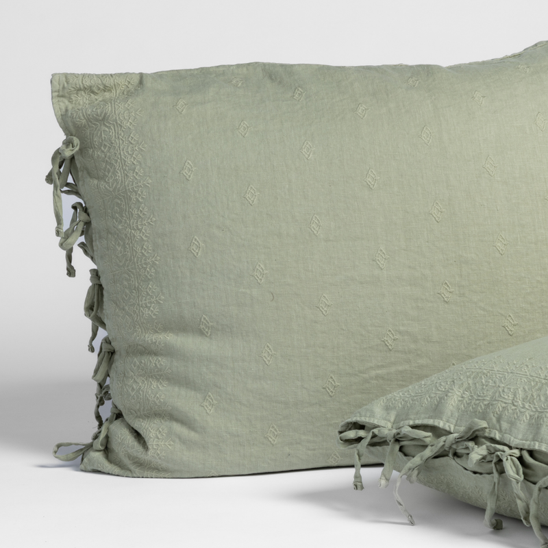 Ines Sham | Desert Sage | matching shams in desert sage, a serenely elegant green, offering a hushed hue, shown against a plain background.