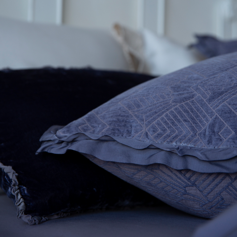 The Trettino Collection | closeup of sham and its double ruffle of satin framing an art deco inspired pattern woven into a chenille jacquard