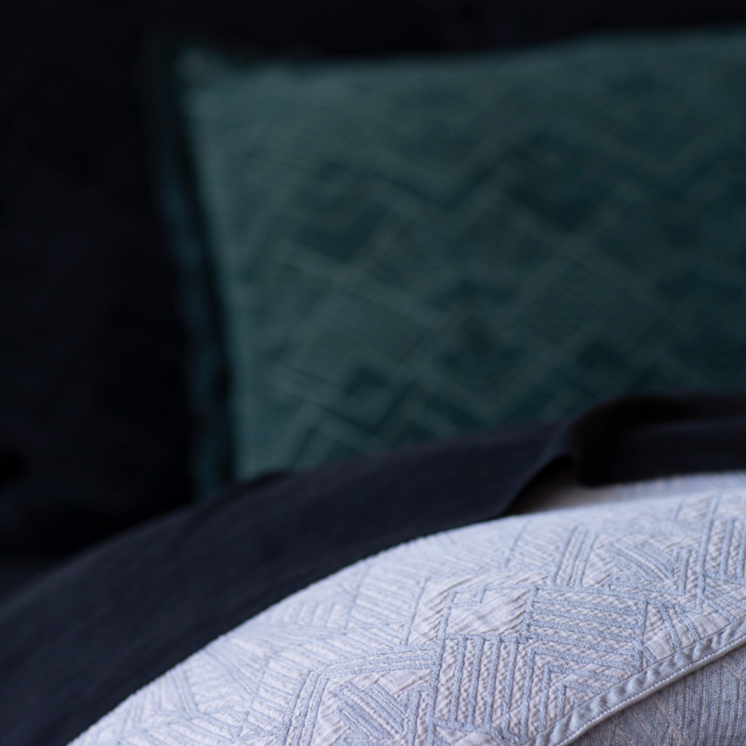 The Trettino Collection | closeup with the focus dropped out of the pillow in the background, showing the pattern details