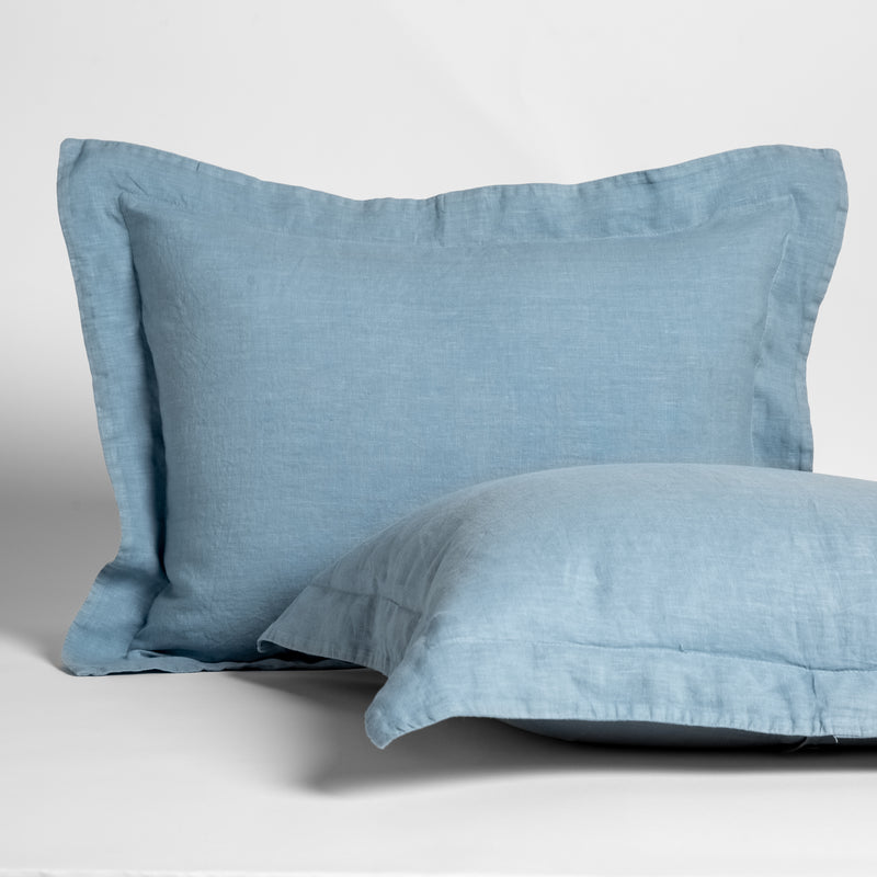 Tahoe Blue | a pair of linen shams against a white background; one is upright and the other on its side.