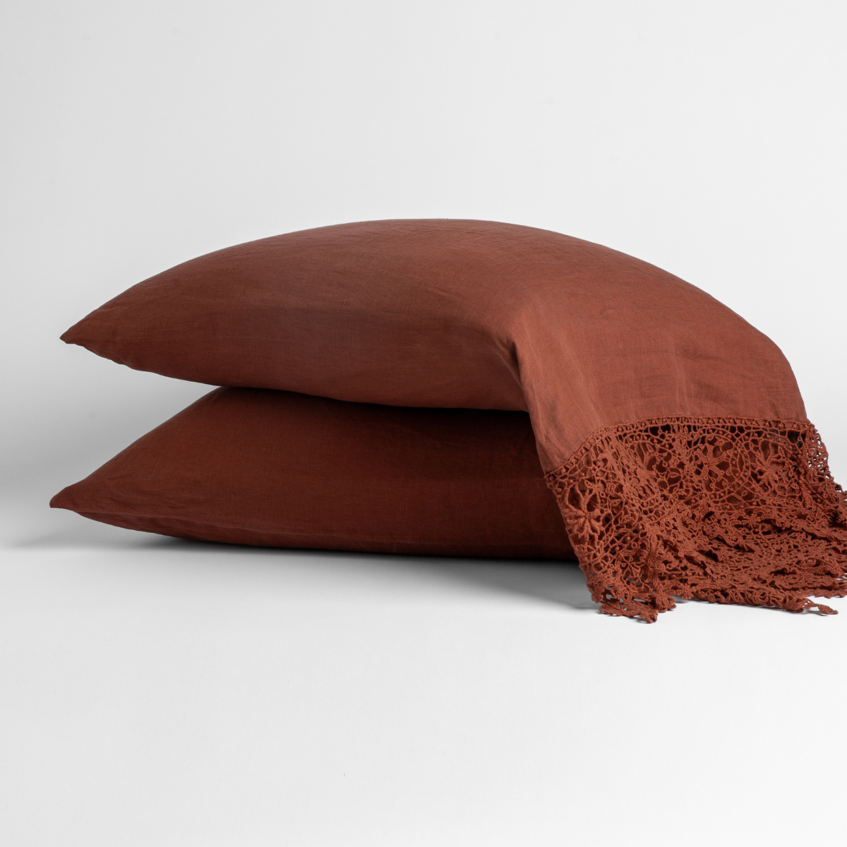 Linen Pillowcase (Single) | Autumn | A pair of Linen Frida pillowcases in Autumn, a rich terracotta tone, shown against a white background.