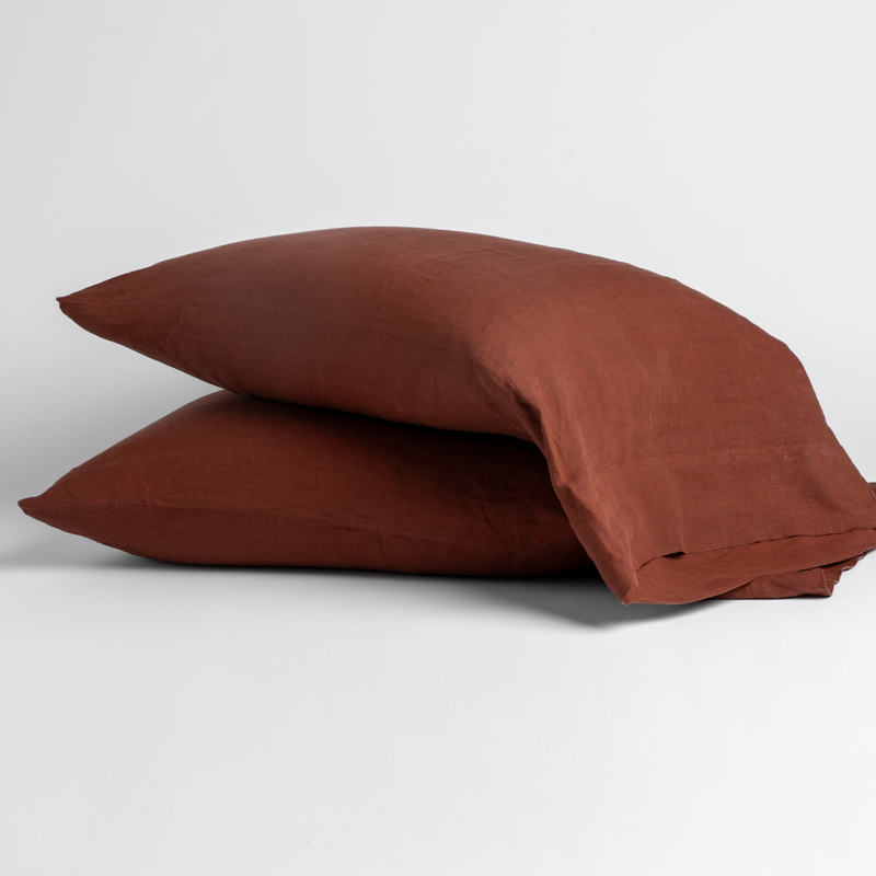 Linen Pillowcase (Single) | Autumn | A pair of Linen pillowcases in Autumn, a rich terracotta tone, shown against a white background.