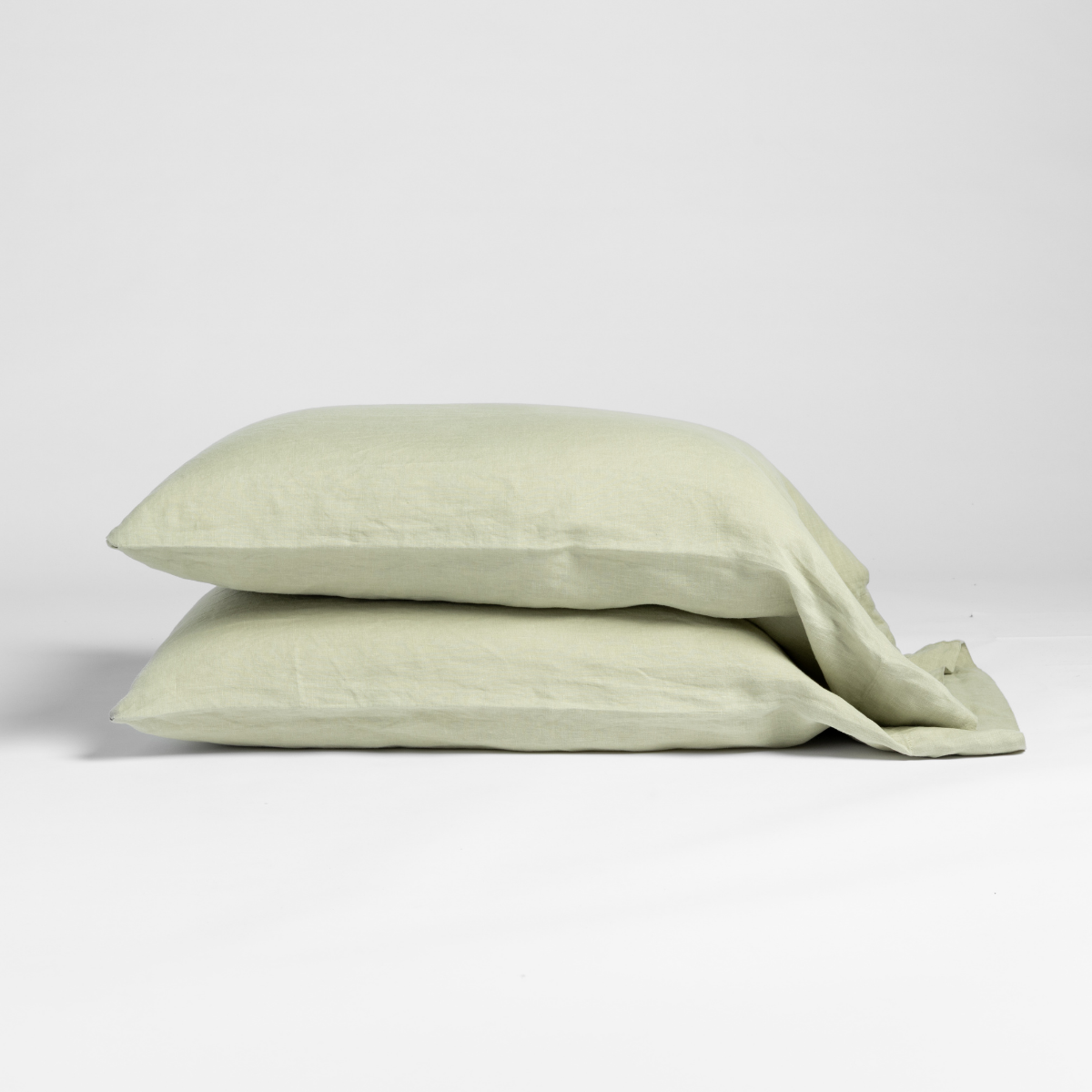 Linen Standard Pillowcase (Single) | Desert Sage | matching pillowcases in desert sage, a serenely elegant green, offering a hushed hue, shown against a plain background.