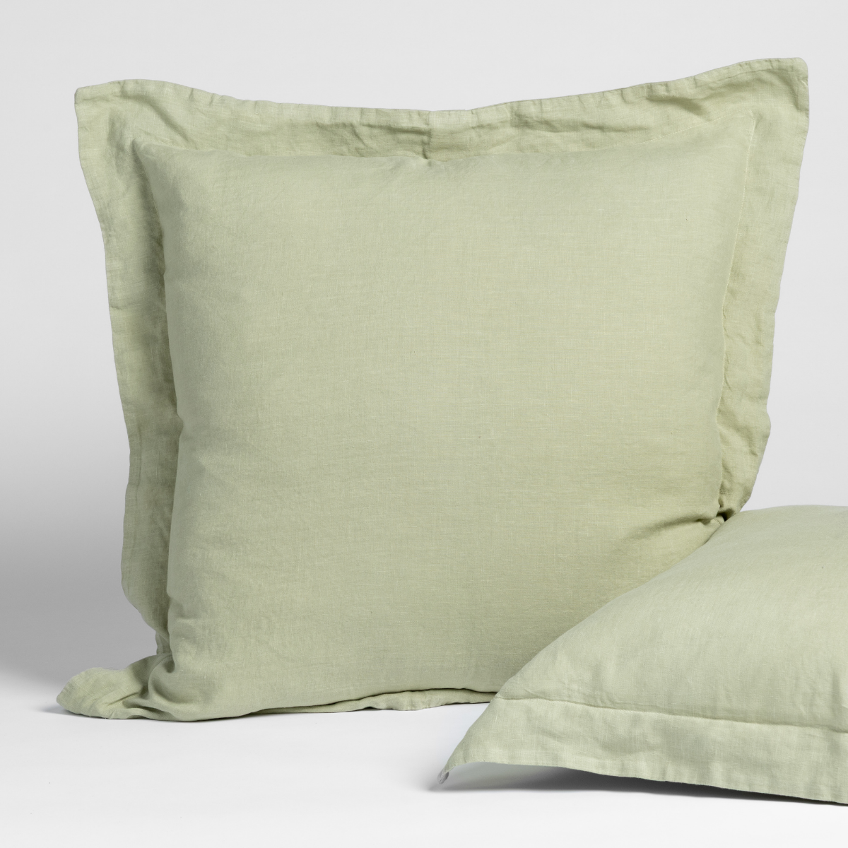 Linen Sham | Desert Sage | matching shams in desert sage, a serenely elegant green, offering a hushed hue, shown against a plain background.