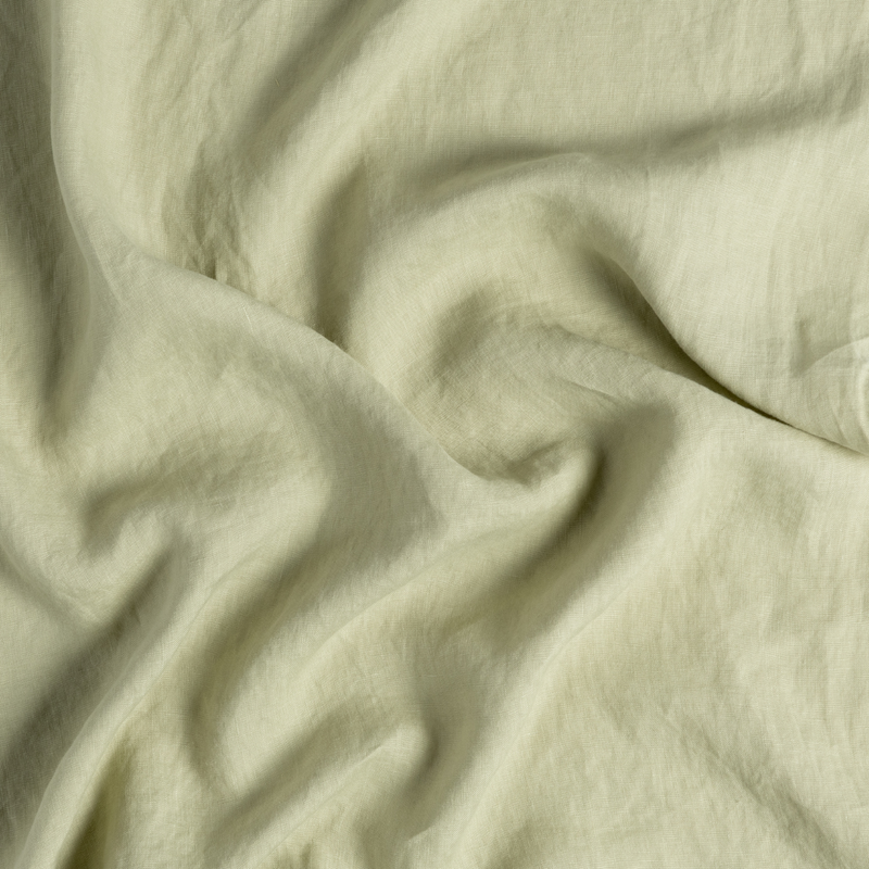 Linen Duvet Cover | Desert Sage | close-up of linen fabric gently rumpled in desert sage, a serenely elegant green, offering a hushed hue.