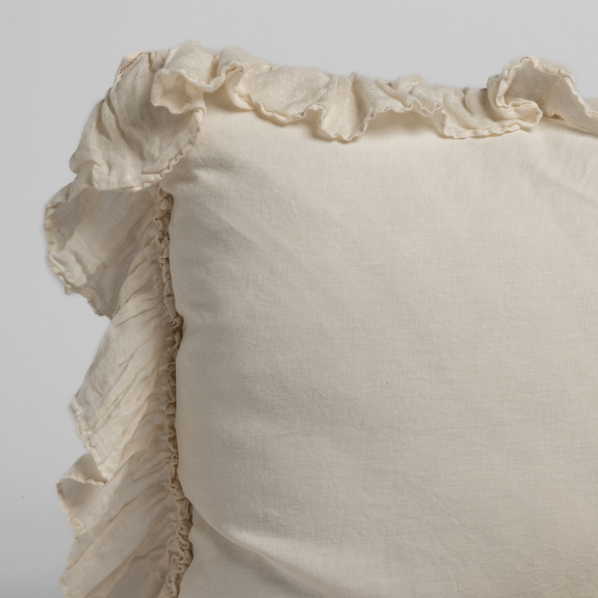 Linen Whisper Sham | Natural | a closeup of the corner of a linen whisper trimmed sham
